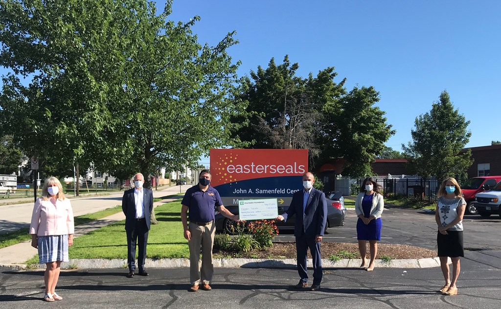 Group photo in front of the Easterseals NH sign on Auburn Street in Manchester, NH.