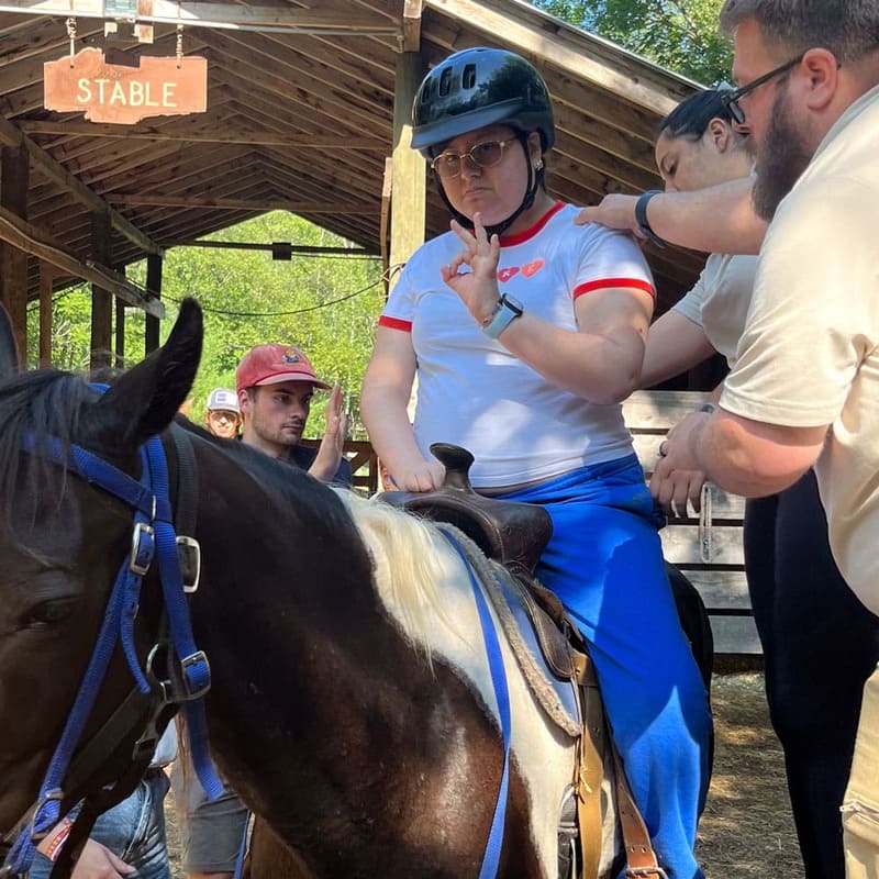 Girl riding a horse during camp at Easterseals NH Camp Sno-Mo