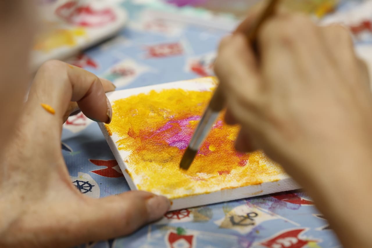 adult day participant painting close up