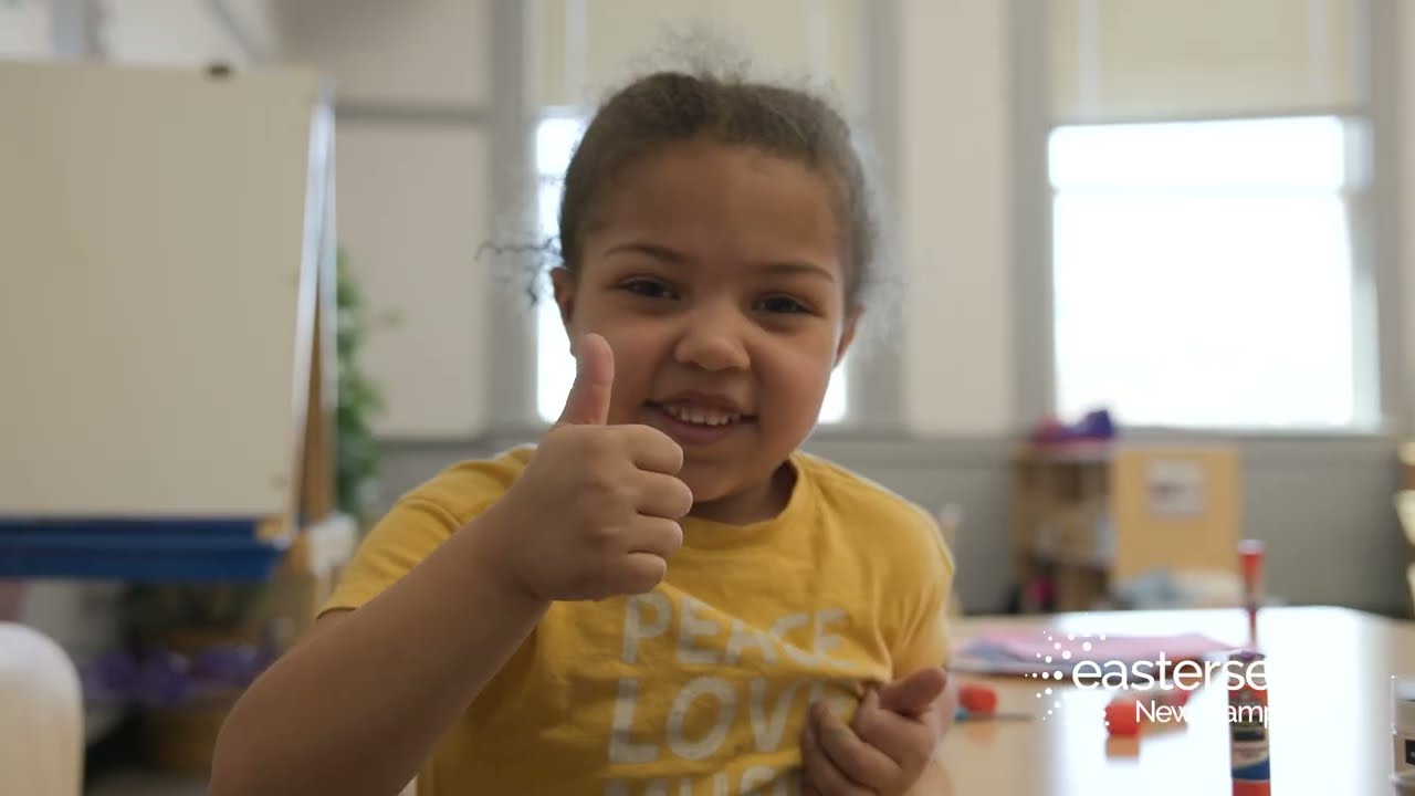 Young girl giving a thumbs up