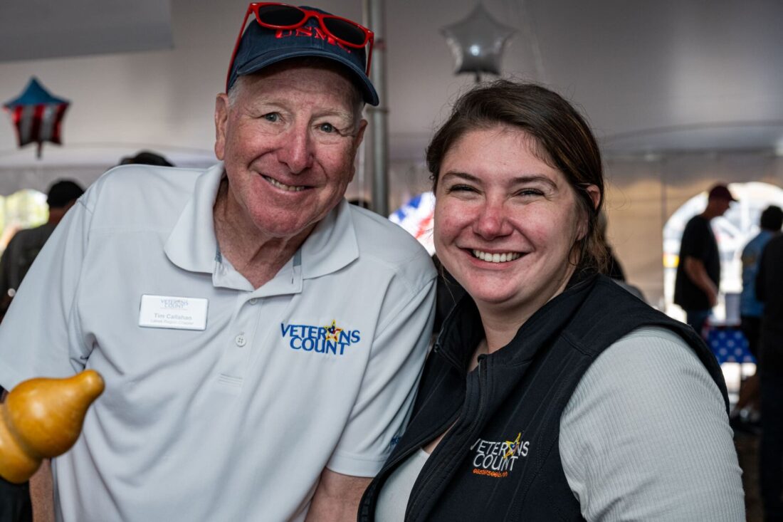 Tim Callahan and Genevieve Wolfe smiling for a picture at the 2023 Veterans Count Red, White & Brew event
