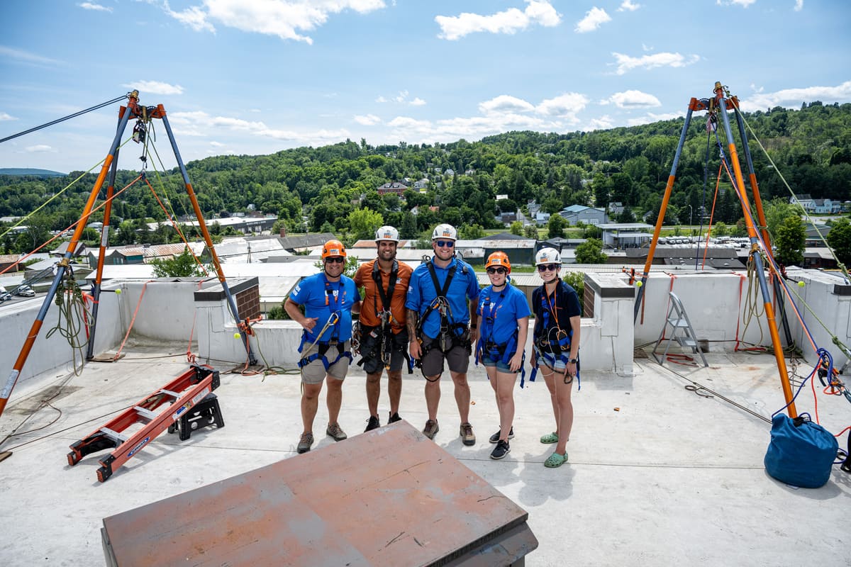 Photo of the Over the Edge and Easterseals NH & VT team on the Barre Manor roof.